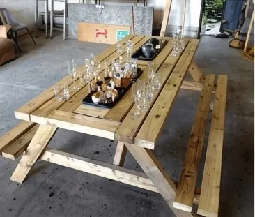 Picnic table with a center bar trough